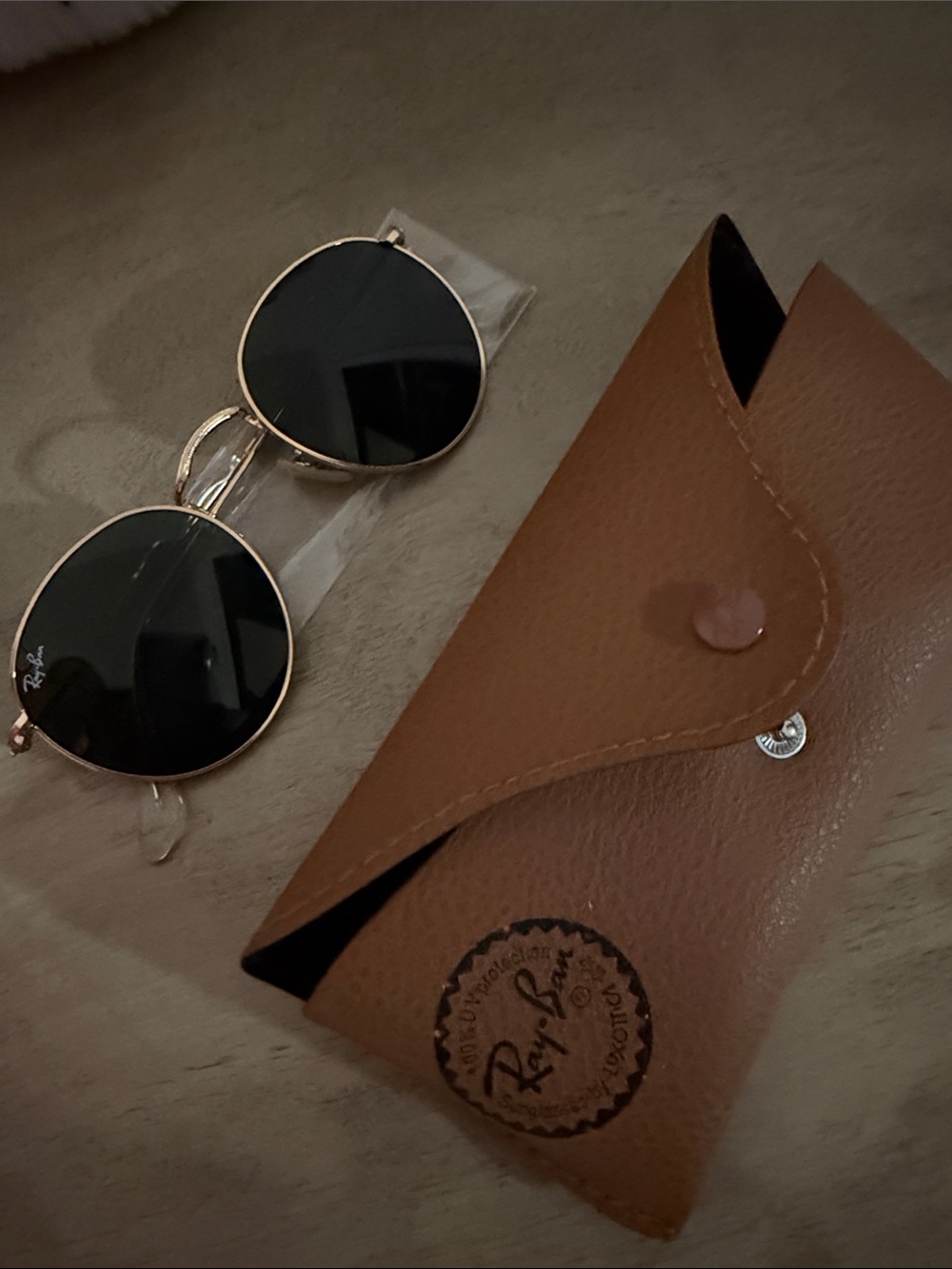 Ray-Ban Women’s Round Metal Sunglasses in Black and Gold with Brown Case